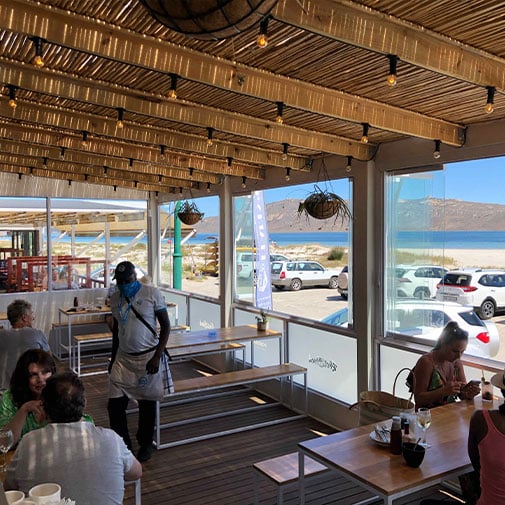 Coastal restaurant with ocean view and casual dining ambiance in South Africa.