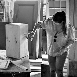 Women crafting wooden furniture