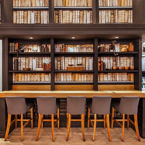 Vibrant modern library with a cozy reading area and stylish bookshelf.
