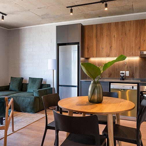 Modern open-plan kitchen and living area with stylish decor and contemporary furnishings.